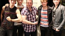 Chris and McFly compare muscles as they say goodbye.