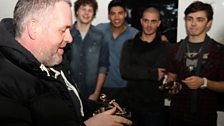 The Wanted lads look on in envy at Chris' trophy