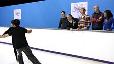 Dave zooms past the team and Christopher Dean