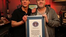 Chris and Dave receive their official certificate from Guiness for the Longest Marathon Radio Show.