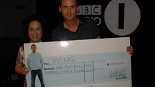 Wing comes in to collect her cheque