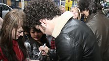 Kevin signs autographs