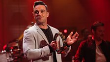 Robbie Williams performing live