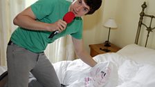 Greg on a house tour showing us his bed and the Radio 1 t-shirt he sleeps in