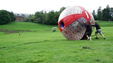 Greg and Producer Sarah "Sphere Rolling" down the hill outside the country house