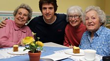 Three of the very lovely residents - Maureen, Muriel and Edna - join Greg over some tea and cakes!