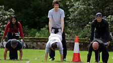 The wheelbarrow race pairs Tina with Dave, Greg with Aled and Vernon with Dom.