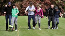 The three-legged race gets underway, with Vernon and Matt, Greg and Sam, Dom and Dave amongst the competitors.