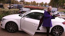 Jo strikes a pose with Aston's wheels