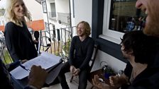 The band chat out on the balcony