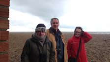 Felicity Evans with Richard Porter and Richard Aspinall on the Norfolk Coast close to Cley Marshes.