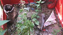 Boots, nettles and broken glass in the phone-box