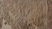 4) After capturing Lachish the Assyrians carry symbols of victory to the king