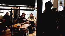 Brian Cox and Jonathan Watson prepare for a scene in a Broughty Ferry coffee shop