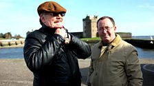 Brian Cox makes some costume adjustments while Jonathan Watson blinks in the famous Tayside sunshine