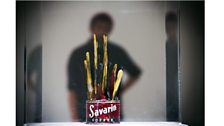 Visitor looks at the work Painted Bronze (1960) by Jasper Johns