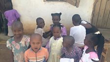 Children queuing up to have a trim