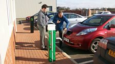 Melvyn charges up his electric car at Rolec Services in Boston