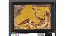 Fragment of a wall painting showing a man reclining to drink. From Pompeii, 1st century AD.