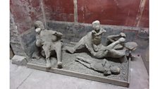 Casts of a group pf a victim, two adultes and two children, very probably a family; House of the Golden Bracelet, Pompeii