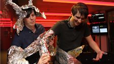 Phil wraps Dan in futuristic robotic metal