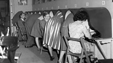 A busy time at the telephone booths