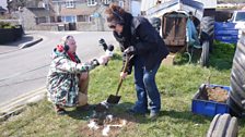 Digging for treasure, as Navigator Ian holds the microphone