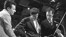 Colin Davis talks with Michael Tippett and Erich Gruenberg, leader of the London Symphony Orchestra, during rehearsal. 1964.