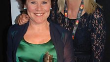 Imelda Staunton shows Anneka Rice her Olivier Award for Best Actress in a Musical