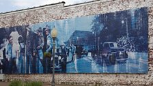 Mural depicting the mob scene from To Kill a Mockingbird, located in Monroeville, Alabama