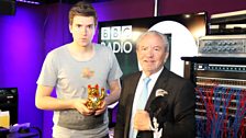 What's Lord Sugar holding?