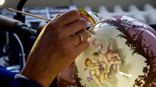 Vase being gilded at Sevres workshop