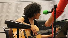 Elaine Mitchener prepares to perform on the guitar in the Late Junction Studio