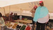 Sheila visits a food stall at the "Champs-Élysées" market