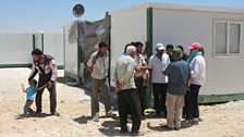 Sheila speaks to refugees at the camp