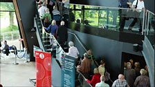 Audience members go into the Dora Stouzker Hall at the RWCMD