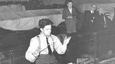 George Lloyd in the pit at the Lyceum conducting his opera Iernin