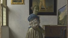 A Young Woman Standing At A Virginal