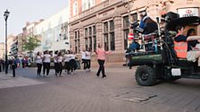 Performers facing the camera on Lincoln High Street in Lipdub Lincoln