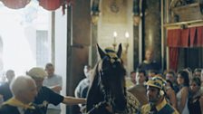 A horse being taken through the Piazza church