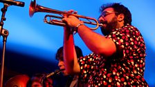 DJ Tudo e sua gente de todo lugar perform on the Radio 3 stage at Womad 2013