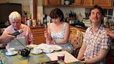 Philip Fox, Julia Hills and Ashley Cook get comfortable in the family kitchen