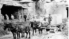 A horse and cart pulling a 4 ton block of beer stone