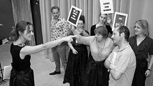 The Votes for Women cast reenact a scene from a Punch magazine cartoon