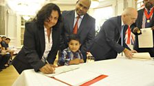 Mini, Shibu and Alun Abraham from India at their citizenship ceremony