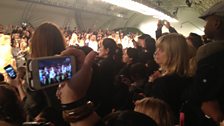 Journalists, stylists and bloggers clamour to get the shot of the catwalk