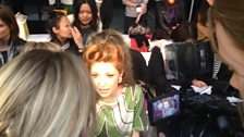 All crowding around Nicola Roberts from Girls Aloud