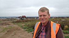 Tom Heap surveys a landfill site