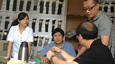 Rex Xu is visited by representatives of the military in Singapore, here to discuss a new order for socks.