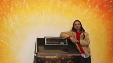 Jeremy Deller with Jukebox, 2013 and mural backdrop by Stuart Sam Hughes